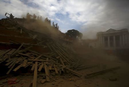 People work to rescue trapped people inside a temple in Bashantapur Durbar Square after an earthquake hit, in Kathmandu, Nepal April 25, 2015. REUTERS/Navesh Chitrakar