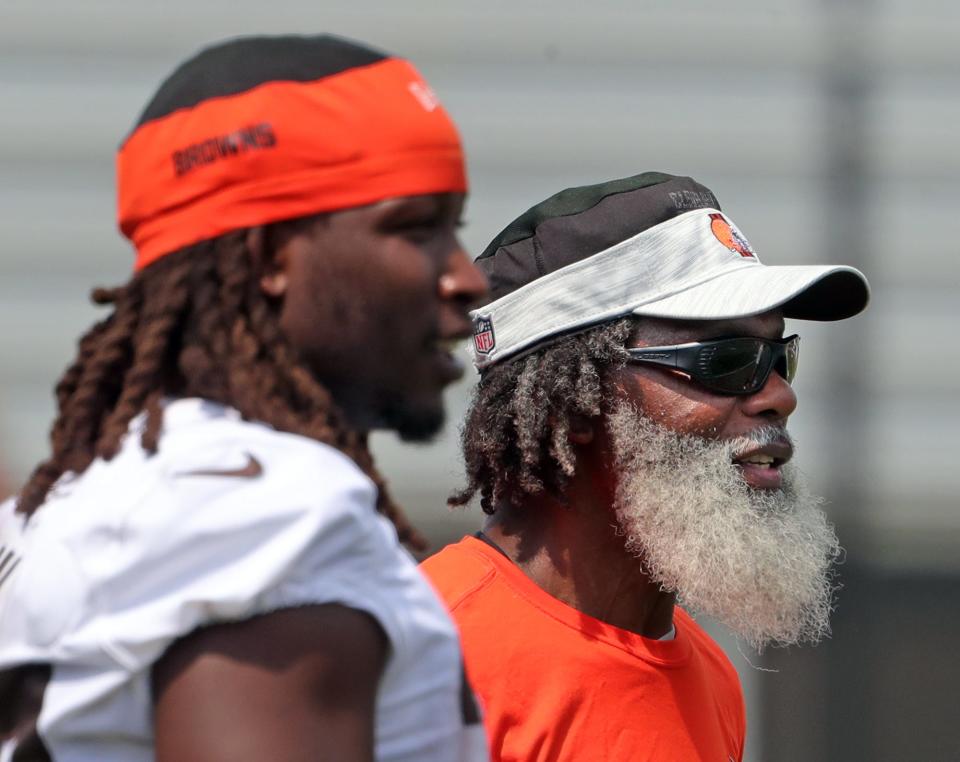 Cleveland Browns running backs coach Stump Mitchell watches the team practice with running back Kareem Hunt during NFL football training camp, Saturday, July 31, 2021, in Berea, Ohio.