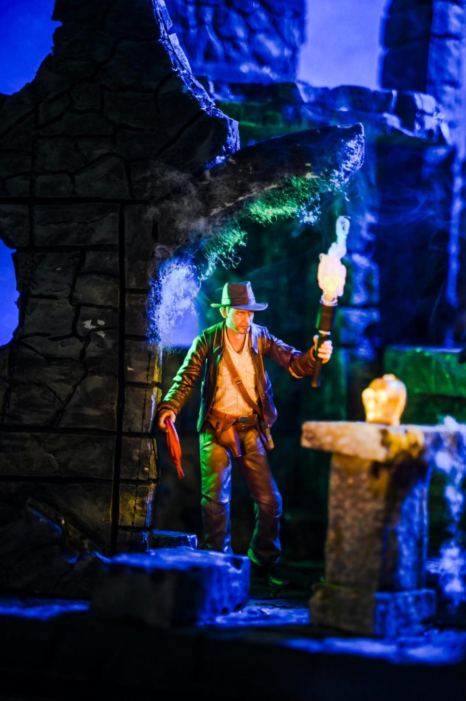 An action figure of Indiana Jones is set up and lit in one of Kevin Epling's toy photography art sets on Wednesday, May 24, 2023, at his home in East Lansing.