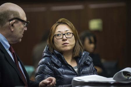 'Nicky' Kyung Chun Min, 33, appears in criminal court in New York January 30, 2014. REUTERS/Steven Hirsch/Pool