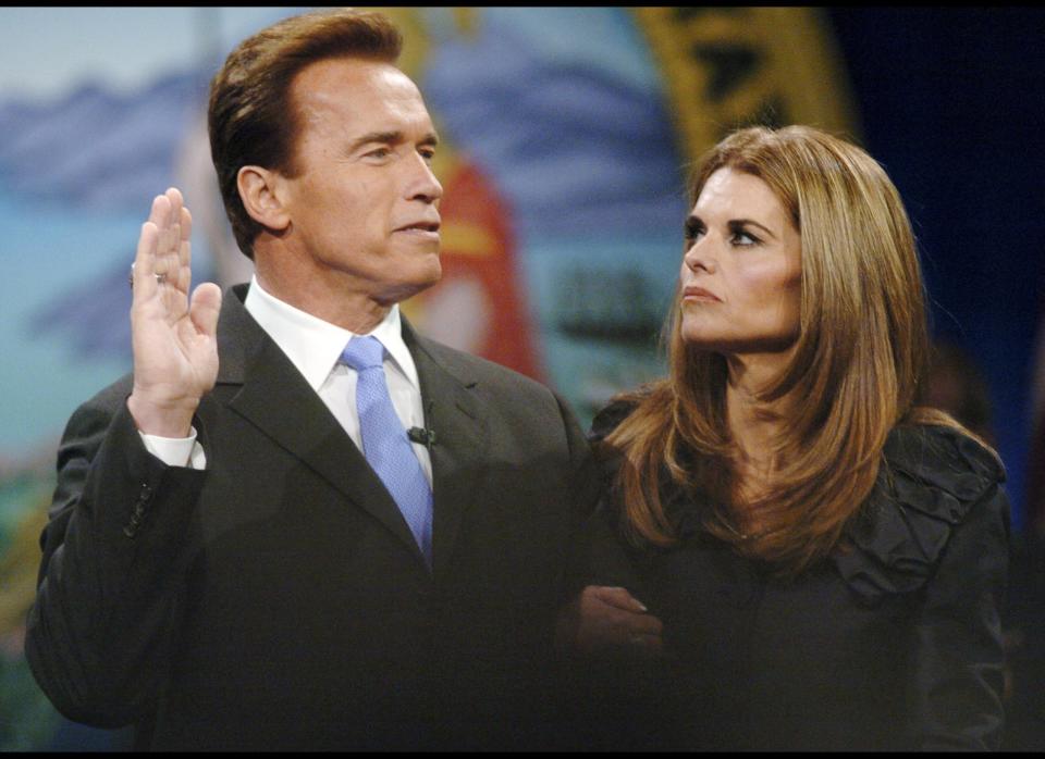 California Gov. Arnold Schwarzenegger, left, takes his oath of office as his wife Maria Shriver looks on in Sacramento, Calif, Friday, Jan. 5, 2007. (AP Photo/Steve Yeater)