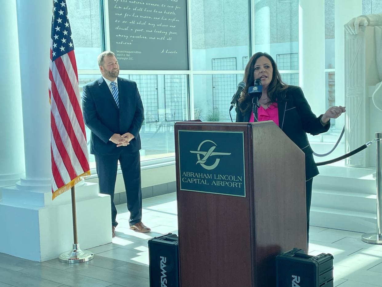 With Springfield Airport Authority executive Mark Hanna behind her, Springfield Mayor Misty Buscher speaks about Abraham Lincoln Capital Airport's new partnership with Breeze Airways Tuesday, Sept. 19, 2023. Breeze will provide non-stop service to Orlando and Tampa, Florida beginning Dec. 1.