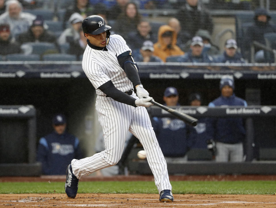 New York Yankees Giancarlo Stanton strikes out swinging in his first at-bat in the first inning of an opening day baseball game against the Tampa Bay Rays at Yankee Stadium in New York, Tuesday, April 3, 2018. (AP Photo/Kathy Willens)