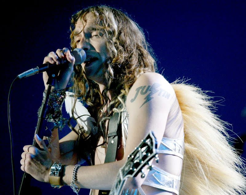 FILE PHOTO: JUSTIN HAWKINS OF THE DARKNESS PERFORM ON STAGE AT THE BRIT AWARDS 2004 IN LONDON.