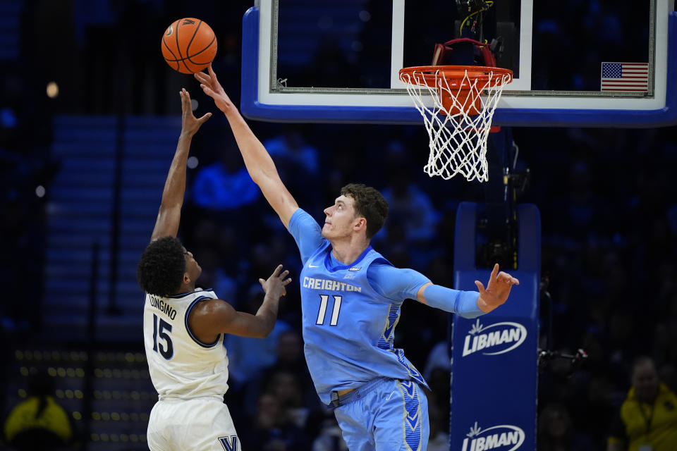 Creighton's Ryan Kalkbrenner, right, blocks a shot Villanova's Jordan Longino during the second half of an NCAA college basketball game, Saturday, March 9, 2024, in Philadelphia. (AP Photo/Matt Slocum)