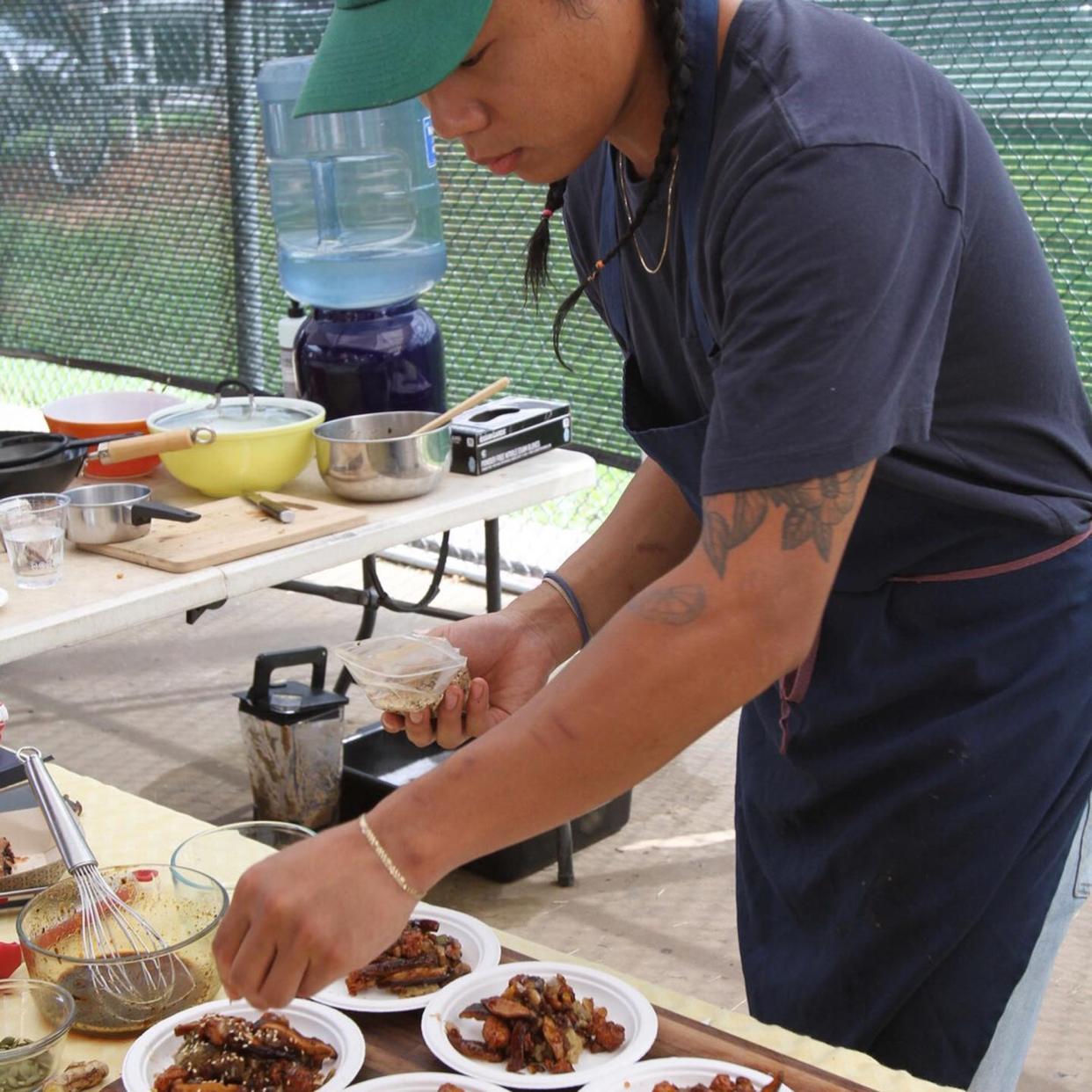 This photo from 2019 shows Puma Yu's chef Pete Amadhanirundr preparing a dish for the Athens Farmers Market's first annual Sliced! cooking competition. Amadhanirundr won the event and will return to compete in Saturday's event.