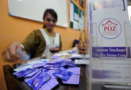 Thanakorn, or Gigi, packs condoms with leaflets before giving them to transgender people at The Poz Home Center in Bangkok. From a cafe near the go-go bars of a Bangkok red light district where she campaigns for safe sex, Gigi gives an unvarnished view of how she joined Thailand's growing ranks of transgender people with HIV