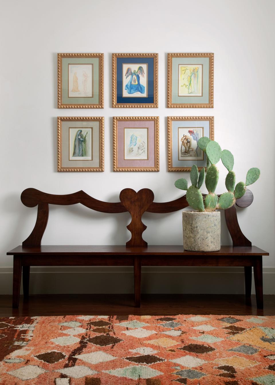 Designer Juniper Tedhams oversaw the soup-to-nuts renovation of her mother Charlotte Herzele's Austin home, a formerly nondescript spec house located on a generous corner lot in a vibrant neighborhood. In the entry, a group of Salvador Dalí watercolors hangs above a custom walnut bench by Erik Gustafson for Juniper Tedhams. The 1940 Berber rug is from FJ Hakimian.