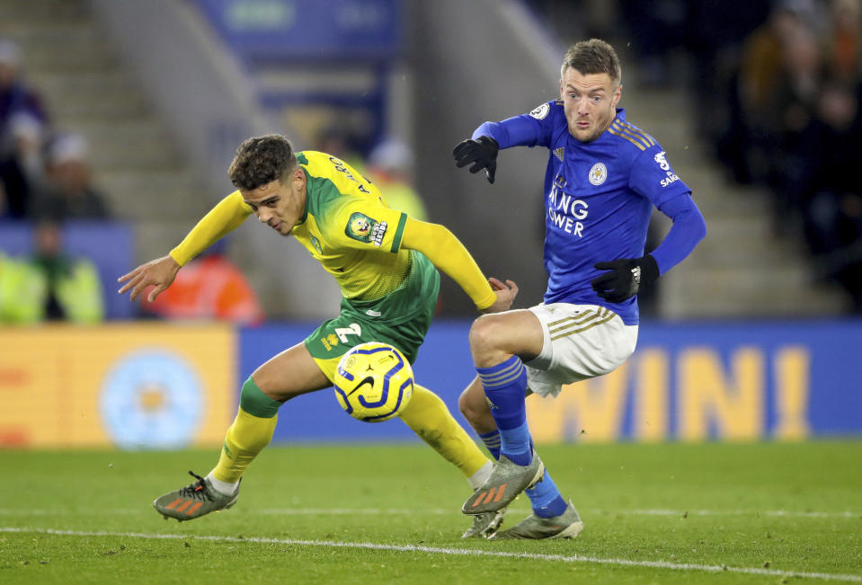 Leicester City's Jamie Vardy, right, and Norwich City's Max Aarons during their English Premier League soccer match at King Power Stadium in Leicester, England, Saturday Dec. 14, 2019. (Nick Potts/PA via AP)