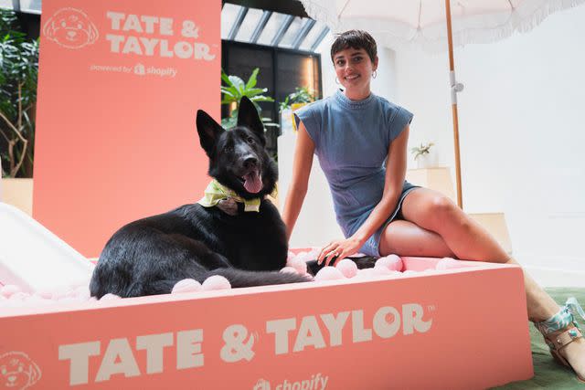 <p>Courtesy of Shopify</p> Taylor Hill and her dog, Salem, at a pop-up celebrating the launch of her brand, Tate and Taylor, in New York City
