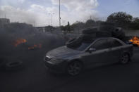 Palestinian protesters block the main road with burning tires in the West Bank city of Jericho, Monday, Feb. 6, 2023. Israeli forces killed five Palestinian gunmen in a raid on refugee camp in the occupied West Bank on Monday, the latest bloodshed in the region that will likely further exacerbate tensions. (AP Photo/Nasser Nasser)