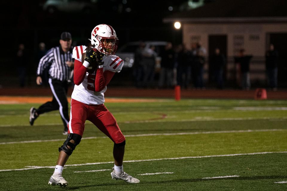 Souderton senior Winday Dawson fields a punt during Thursday night's 27-14 PIAA District One Class 6A quarterfinal playoff loss to Perkiomen Valley,