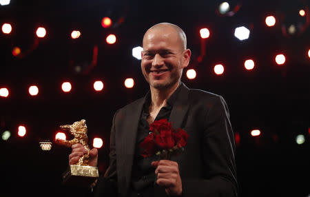 Nadav Lapid shows Golden Bear for Best Film after the awards ceremony at the 69th Berlinale International Film Festival in Berlin, Germany, February 16, 2019. REUTERS/Hannibal Hanschke