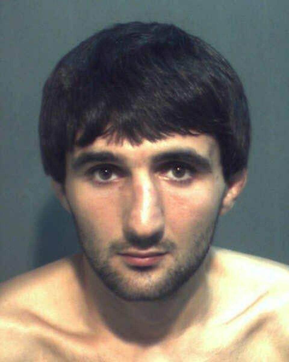 Ibragim Todashev poses for a booking photo after being arrested for aggravated battery on 4 May 2013 in Orlando, Florida (Orange County Sheriff's Office via Getty Images)