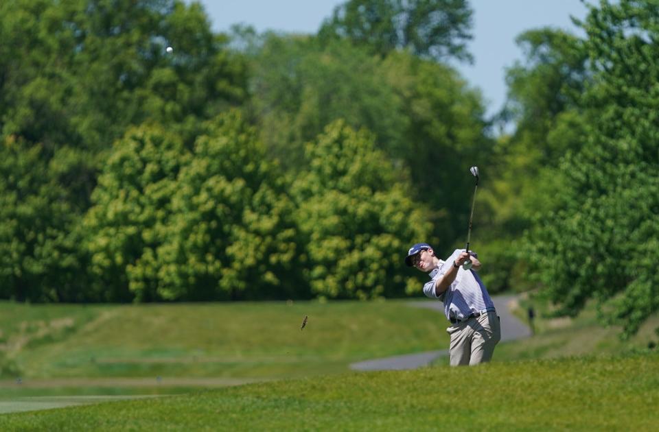Harrison's Tommy Mangan hits from a fairway bunker on the 10th hole during the Section 1 boys golf championships at Trump National Golf Club-Hudson Valley in Hopewell Junction on Wednesday, May 17, 2023.