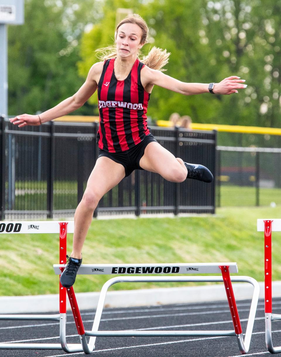 Edgewood's Addison Goerges hits a hurdle in the 300 meter hurdles during the 2021 Western Indiana Conference track meet at Edgewood on May 12. With more training this year, she's clearing all the hurdles, posting a career best of 49.77 to win the WIC title last week.