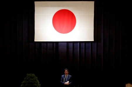 FILE PHOTO - Japan's Prime Minister Shinzo Abe address Japan Self-Defense Force's senior members during a meeting at the Defense Ministry in Tokyo, Japan, September 11, 2017.   REUTERS/Toru Hanai