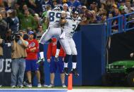 TORONTO, ON - DECEMBER 16: Russell Wilson #3 of the Seattle Seahawks celebrates his rushing touchdown with Doug Baldwin #89 during an NFL game against the Buffalo Bills at Rogers Centre on December 16, 2012 in Toronto, Ontario, Canada. (Photo by Tom Szczerbowski/Getty Images)