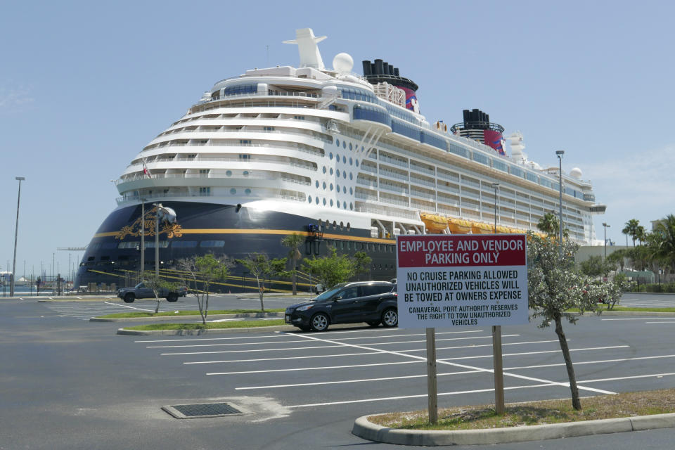 Due to the coronavirus, a Disney cruise ship is docked at Port Canaveral Saturday, April 4, 2020, in Cape Canaveral, Fla. Disney cruises are suspended till further notice. (AP Photo/John Raoux)