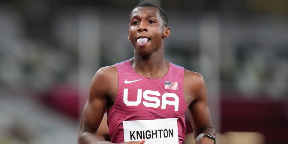 Erriyon Knighton sticks his tongue out after a race.