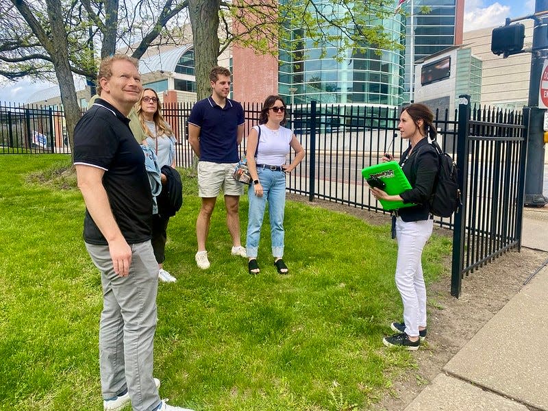 A brief stop during an Akron BLU Zone Tour features a snippet of Akron's history with tour guide and owner of Explore City Tours, Barb Abbott.