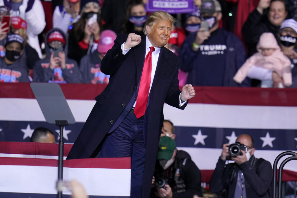 President Donald Trump moves to the song YMCA as he finishes a campaign rally at John P. Murtha Johnstown-Cambria County Airport in Johnstown, Pa., Tuesday, Oct. 13, 2020. (AP Photo/Gene J. Puskar)