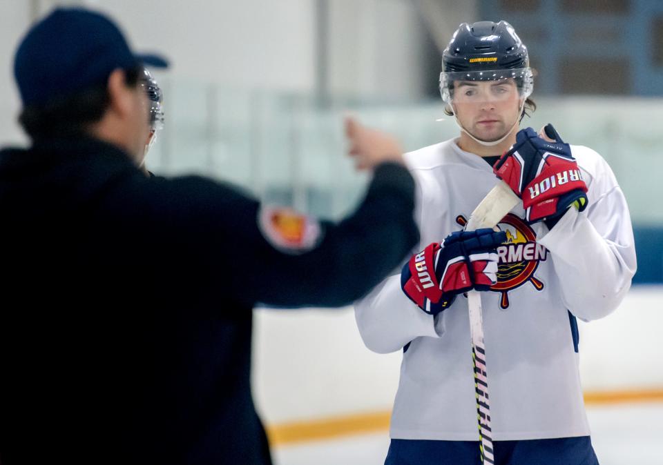 Tristan Trudel listens intently as his father and head coach Jean-Guy Trudel talks with the Rivermen during training camp Tuesday, Oct. 10, 2023 at Owens Center.