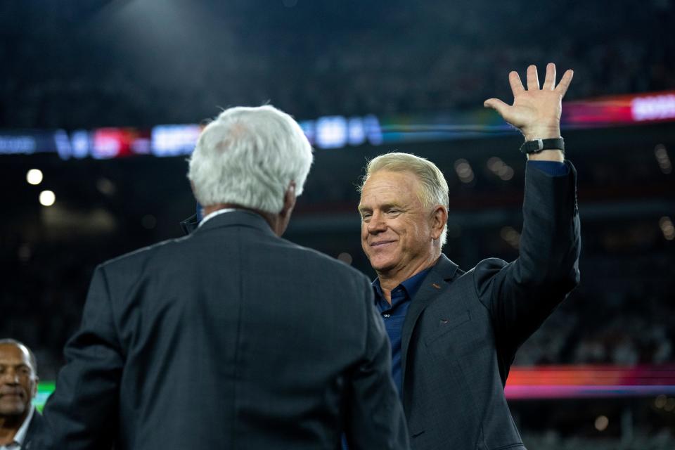 Boomer Esiason, former Cincinnati Bengals quarterback, waives before being announced at halftime as a Bengals Ring of Champions inductee at halftime of the NFL game between the Cincinnati Bengals and Los Angeles Rams at Paycor Stadium in Cincinnati on Monday, Sept. 25, 2023.