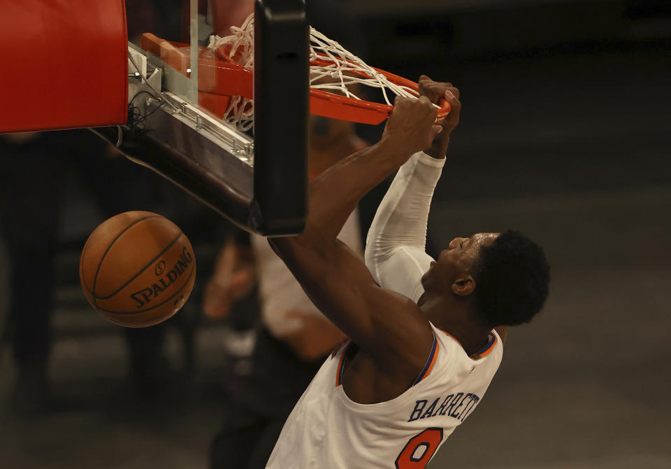 New York Knicks' RJ Barrett dunks in the second half against the Indiana Pacers during an NBA basketball game Saturday, Feb. 27, 2021, in New York. (Elsa/Pool Photo via AP)