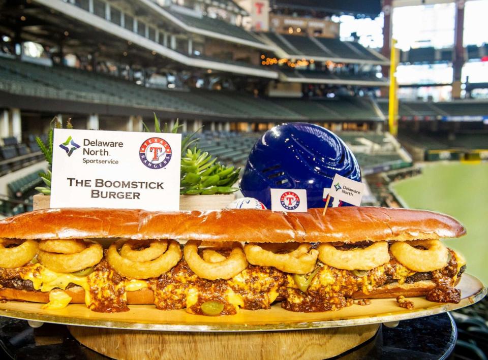 PHOTO: The new Boomstick Burger, a 2-foot-long Nolan Ryan Beef patty topped with Texas Chili Company Chili, Rico's Nacho Cheese and Jalapenos, and Crisp Onion Rings and served on a fresh-baked brioche bun. (Texas Rangers)