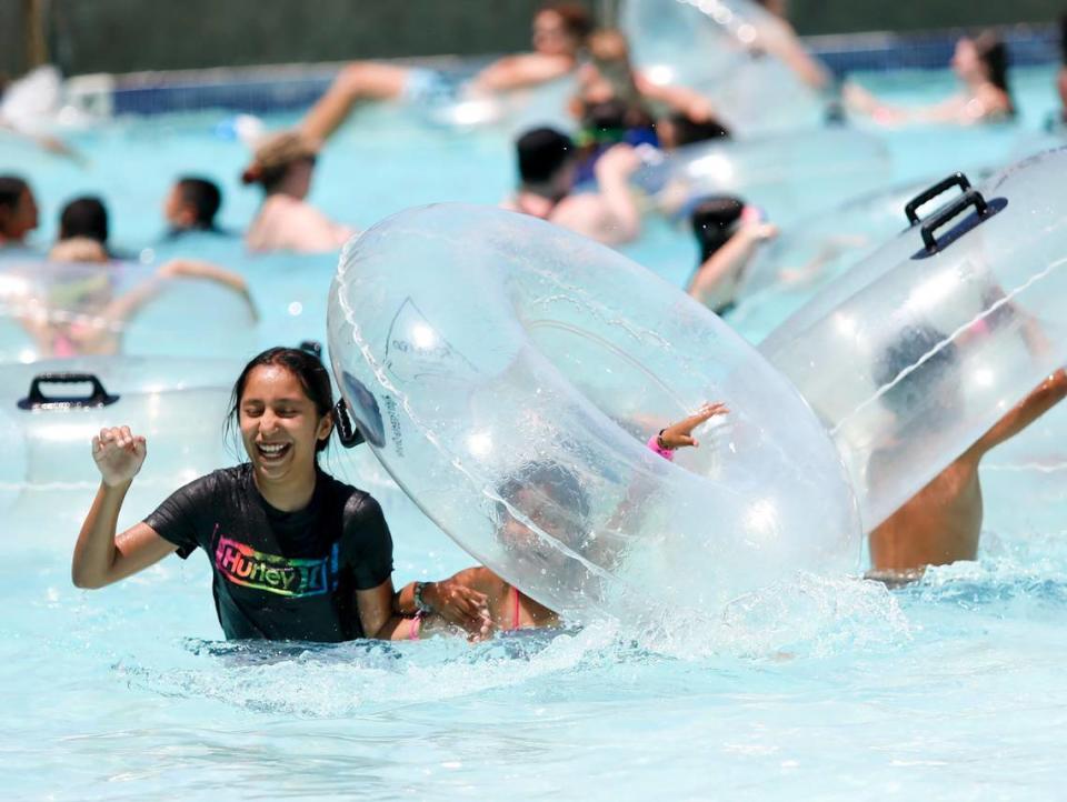 Kids play in the Calypso Bay Wave Pool at The Ravine Water Park in Paso Robles as temperatures hit the triple-digits on Thursday, July 27, 2023.