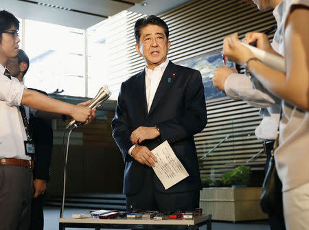 Japanese Prime Minister Shinzo Abe speaks to reporters about North Korea's missile launch in Tokyo, Japan in this photo taken by Kyodo on August 29, 2017. Kyodo/via REUTERS