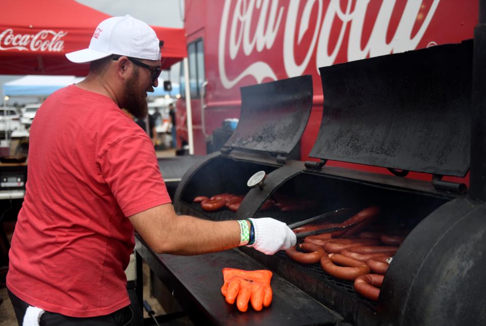 A Hub City BBQ Cookoff competitor smokes sausage, Thursday, Oct. 6, 2022, at the South Plains fairgrounds. 