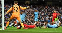 <p>Raheem Sterling misses a tap in before Fernandinho hits the side netting with the goal gaping </p>