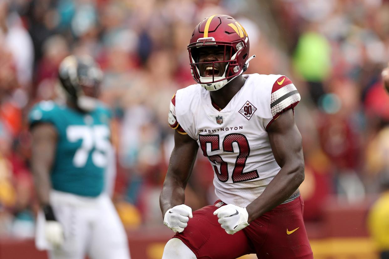 Jamin Davis #52 of the Washington Commanders celebrates after sacking Trevor Lawrence #16 of the Jacksonville Jaguars (not pictured) during the first half at FedExField on September 11, 2022 in Landover, Maryland.