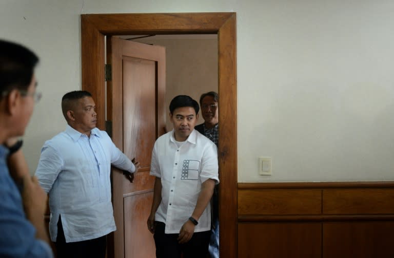 Vice President Jejomar Binay arrives at his office to meet his supporters and village chiefs at the Makati City Hall in Manila's financial district on March 20, 2015