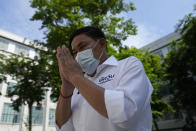 Bangkok governor independent candidate Asawin Kwanmuang prays to a Buddhist statue during an election campaign in Bangkok, Thailand. Tuesday, May 17, 2022. Residents of the Thai capital Bangkok will cast their ballots for the city’s leader Sunday in a vote seen as a barometer of the public mood ahead of an approaching general election. (AP Photo/Sakchai Lalit)