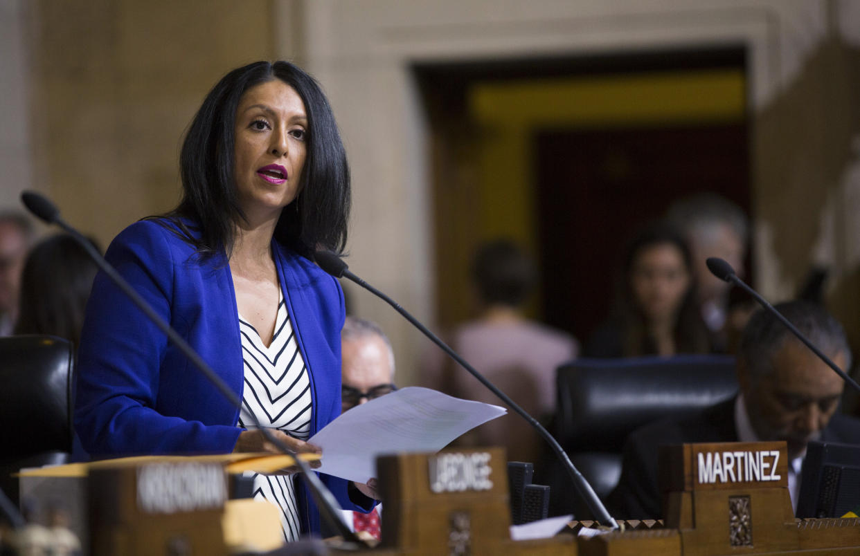 Council member Nury Martinez at the microphone in the council chamber.