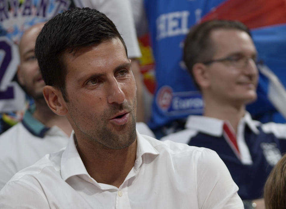 Serbian tennis player Novak Djokovic before the FIBA Basketball World Cup 2023 European qualifiers match between Serbia and Greece, in Belgrade, Serbia, Thursday, Aug. 25, 2022. (AP Photo/Darko Vojinovic)