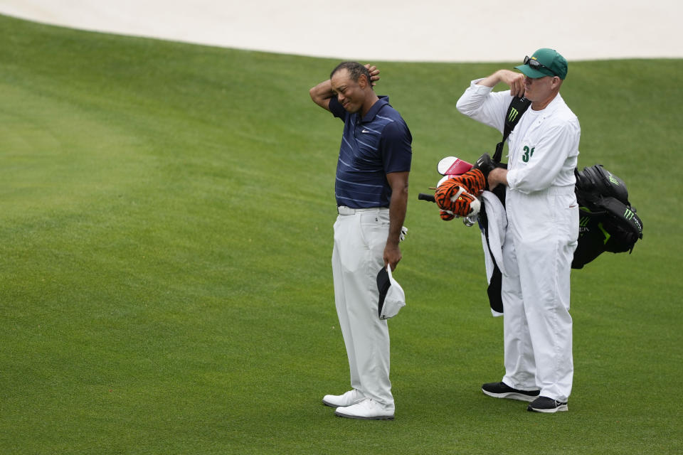 Tiger Woods prepares to leave the course after stop during the second round of the Masters golf tournament at Augusta National Golf Club on Friday, April 7, 2023, in Augusta, Ga. (AP Photo/David J. Phillip)