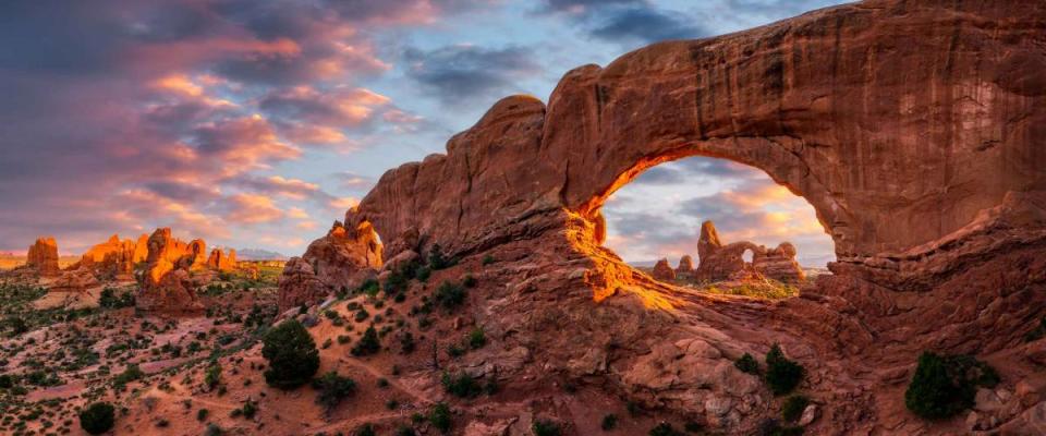 Evening light over North Window with Turret Arch in the distance, Arches National Park Utah