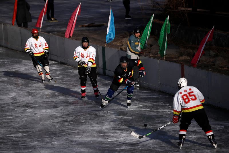 The Wider Image: On a frozen pond far from the Olympics, meet China's ice hockey veterans