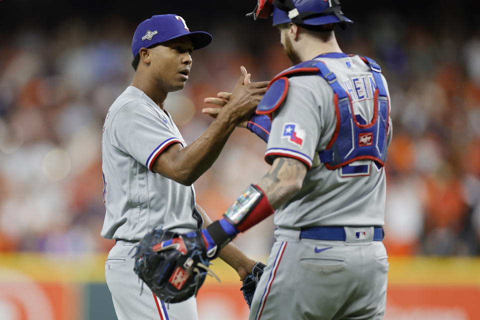 Jose Leclerc (left) has pitched the ninth inning in all seven of the Texas Rangers' victories this postseason. (Photo by Carmen Mandato/Getty Images)