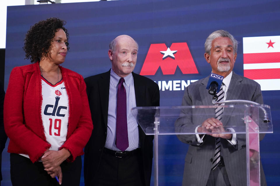 Ted Leonsis, right, owner of the Washington Wizards NBA basketball team and Washington Capitals NHL hockey team, speaks during a news conference with Washington DC Mayor Muriel Bowser, left, and DC Council Chairman Phil Mendelson, center, at Capitol One Arena in Washington, Wednesday, March 27, 2024. (AP Photo/Stephanie Scarbrough)