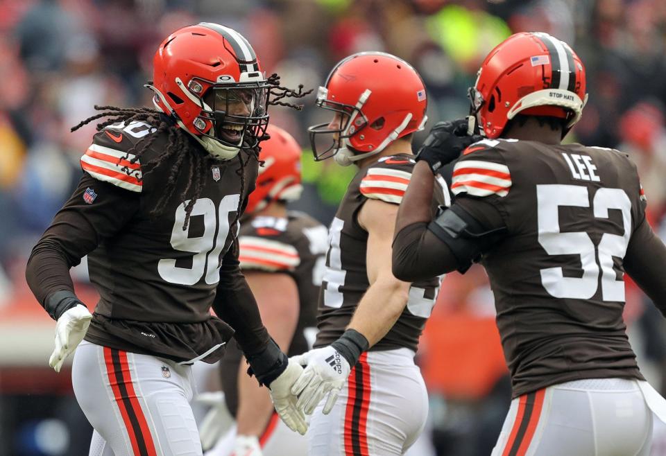 Cleveland Browns defensive end Jadeveon Clowney (90) celebrates after a sack during the first half of an NFL football game against the Cincinnati Bengals, Sunday, Jan. 9, 2022, in Cleveland, Ohio. [Jeff Lange/Beacon Journal]