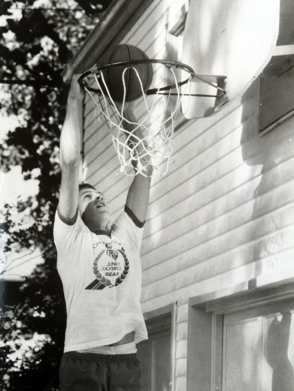 CBA’s John Crotty dunks a ball at his family’s home in Spring Lake in 1986.