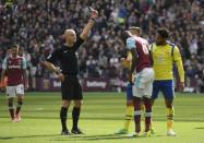 Britain Soccer Football - West Ham United v Everton - Premier League - London Stadium - 22/4/17 Everton's Ashley Williams is shown a yellow card by referee Roger East for a foul on West Ham United's Cheikhou Kouyate Reuters / Toby Melville Livepic