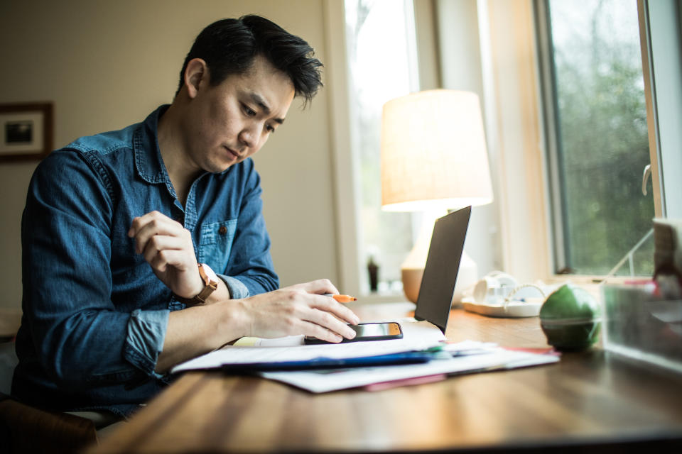 Man (early 30s) working in home office