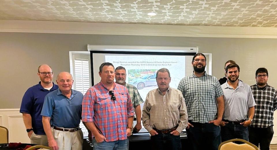 Members of the North Texas Geological Society include, left to right, Chris Gunn, Craig Reynolds, Chad Cummings, Cris Astorga, award recipient Gregg Norman, MSU Texas graduate students Aarron Hillard and Matthew Kaspar, partially obscured, NTGS President Josh Aaron, and graduate students James Mora and Elizabeth Elkins.