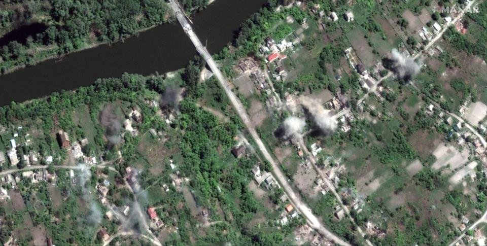 Additional artillery explosions along Siverskyi Donets River and town of Bogorodichne (Satellite image ©2022 Maxar Technologies.)